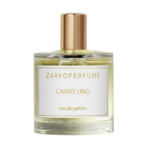 Zarkoperfume - Carate Urio klarer Parfumflakon mit goldfarbenem Verschluss und schlichtem Etikett vor weißem Hintergrund