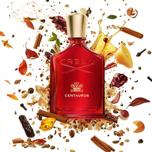 Creed - Centaurus Parfümflakon in tiefrotem Glas mit goldfarbenem Verschluss und würzigem Aromahintergrund