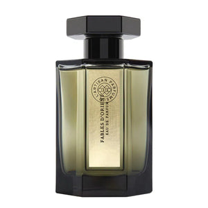 L'Artisan Parfumeur - Les Merveilles - Fables d'Orient Flakon mit goldfarbenem Etikett und schwarzem Verschluss vor weißem Hintergrund