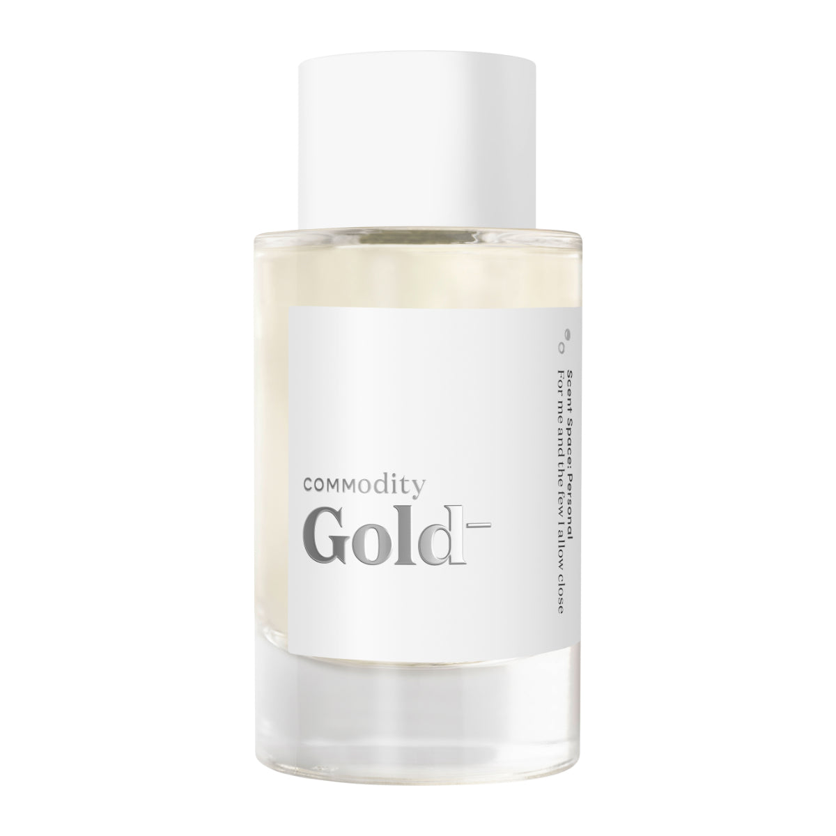 Commodity - Gold- Parfumflakon mit weißem Etikett und schlichtem Design vor hellem Hintergrund präsentiert