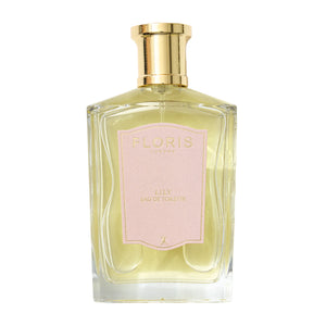 Floris - Lily klarer Parfumflakon mit goldfarbenem Verschluss und zartem rosa Etikett vor weißem Hintergrund