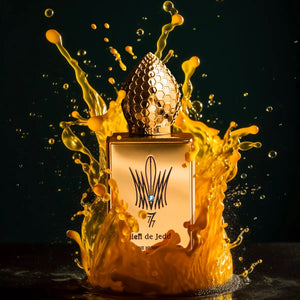 Stéphane Humbert Lucas 777 - Mango Kiss Parfumflakon mit goldener Wabenstruktur und orangem Farbklecks vor dunklem Hintergrund