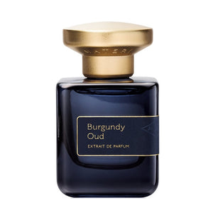 Atelier Materi - Burgundy Oud Parfumflakon in tiefdunklem Burgunderglas mit goldfarbenem Verschluss vor weißem Hintergrund