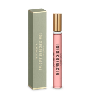 Penhaligon's - Portraits - The Coveted Duchess Rose eleganter Flakon mit goldfarbenem Verschluss neben schlicht grüner Verpackung