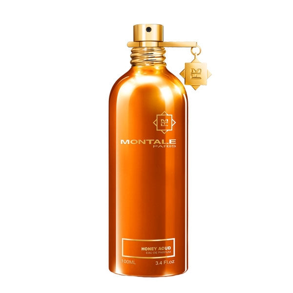Montale - Honey Aoud Parfümflakon in glänzendem Bernstein mit goldenem Zerstäuber vor weißem Hintergrund