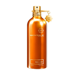 Montale - Honey Aoud Parfümflakon in glänzendem Bernstein mit goldenem Zerstäuber vor weißem Hintergrund