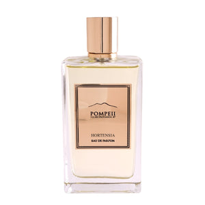 Pompeii - Hortensia Parfumflakon mit klarem Glas und roségoldenem Etikett vor weißem Hintergrund
