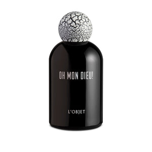 L'Objet - Oh Mon Dieu! Parfum in tiefschwarzem Glas mit charakteristischem weiß-rissigem Kugelverschluss präsentiert