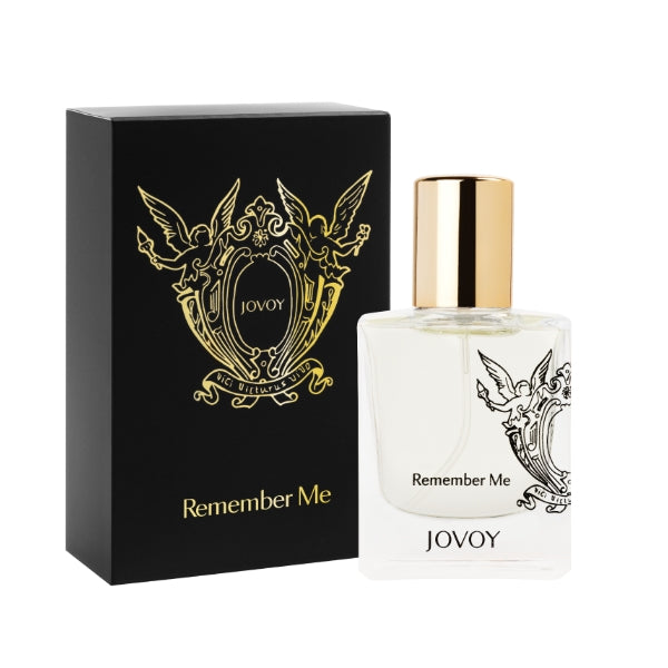 Jovoy - Remember Me Parfumflakon mit transparentem Glas, goldfarbenem Verschluss und schwarzer Verpackung mit Ornamenten
