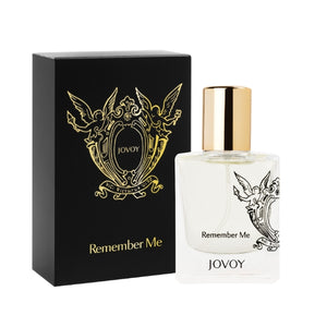 Jovoy - Remember Me Parfumflakon mit transparentem Glas, goldfarbenem Verschluss und schwarzer Verpackung mit Ornamenten