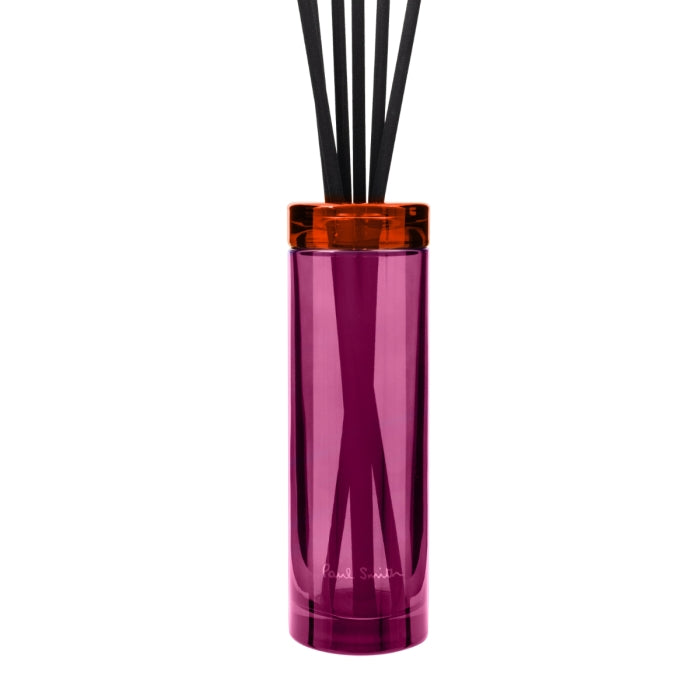 Paul Smith - Rose - Diffusor im pinken Glas mit orangenem Deckel und schwarzen Stäbchen für blumige Duftakzente im Raum
