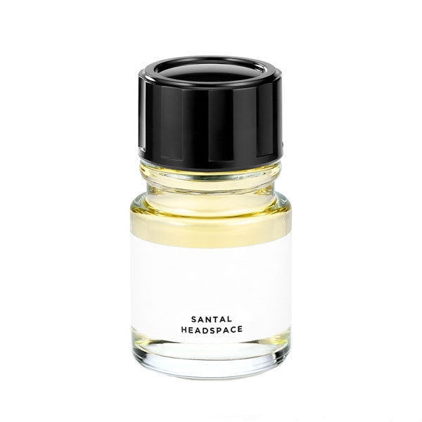 Headspace - Santal Parfumflakon mit hellem Flüssigkeitsinhalt und schwarzem Deckel vor schlicht weißem Hintergrund