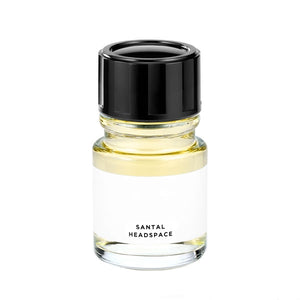 Headspace - Santal Parfumflakon mit hellem Flüssigkeitsinhalt und schwarzem Deckel vor schlicht weißem Hintergrund