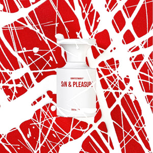 BORNTOSTANDOUT - Sin & Pleasure weißer Flakon mit rotem Schriftzug vor künstlerischem rot-weißem Splatter-Hintergrund