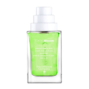 The Different Company - L'Esprit Cologne - Tokyo Bloom Flakon mit grünem Inhalt und weißem Verschluss vor weißem Hintergrund