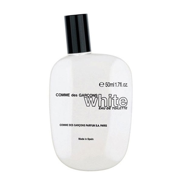 Comme des Garçons - White Parfumflakon mit klarem, schlichtem Design und schwarzem Verschluss vor weißem Hintergrund